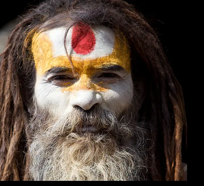 Sadhu, a holy man, with painted face and dreadlocks in Kathmandu, Nepal.
