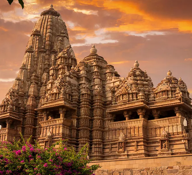 Ornate Khajuraho temple complex at sunset, UNESCO World Heritage Site. Jetsetters Travel Concierge.