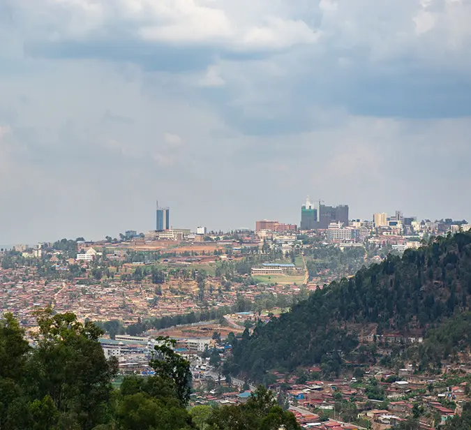 Panoramic view of Kigali, Rwanda’s capital, surrounded by lush green hills.