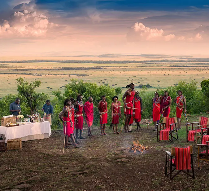 Maasai warriors entertain guests with dance during sundowners at Ngorongoro Crater.