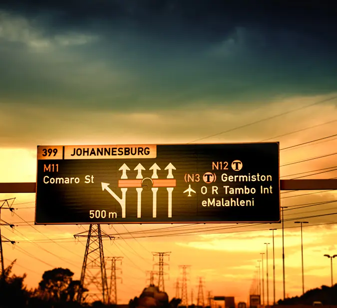 Road sign in Johannesburg directing to O.R. Tambo International Airport.