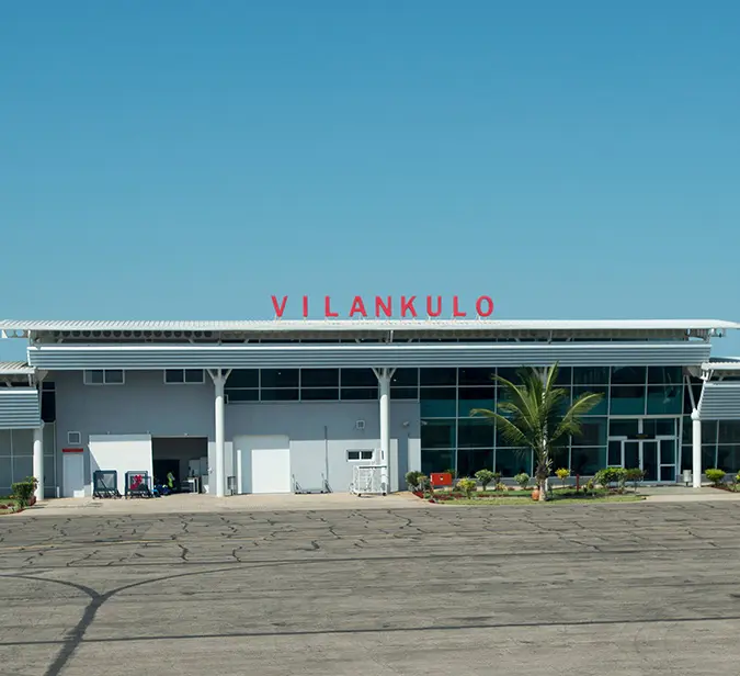 Exterior view of Vilankulo Airport under clear blue skies in Mozambique.