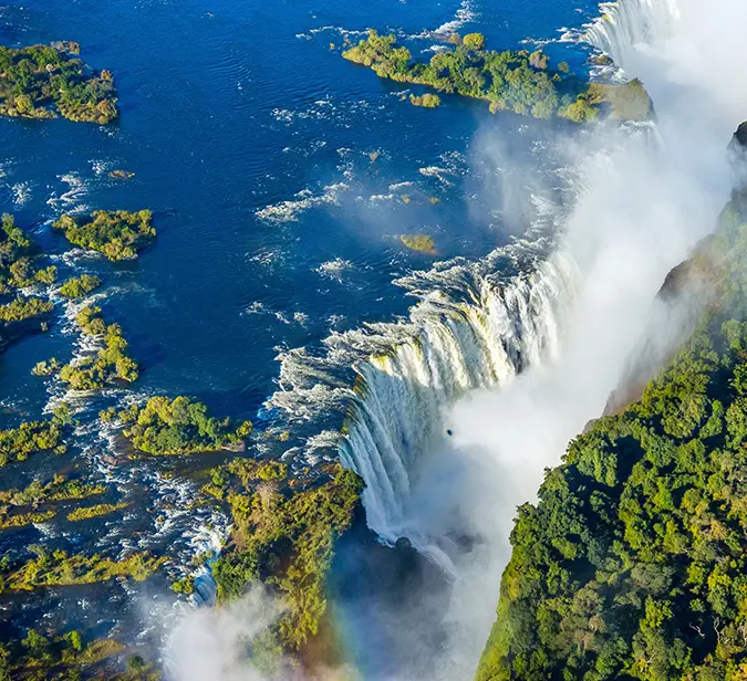 Dramatic bird’s-eye view of Victoria Falls and Zambezi River gorge.