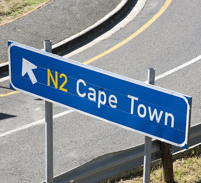 Road sign pointing to Cape Town on the N2 highway in South Africa.