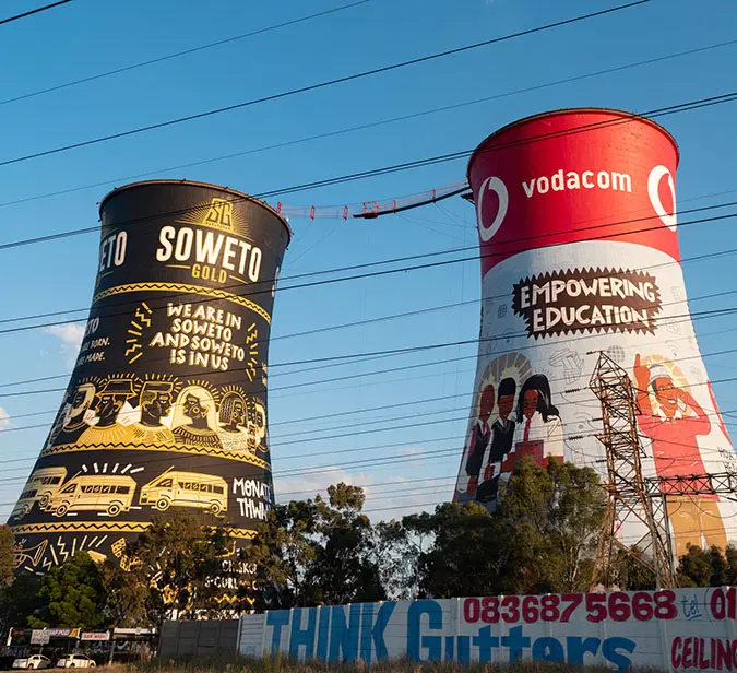 Vibrant street art on iconic Orlando Towers in Soweto, symbolizing heritage and community empowermen