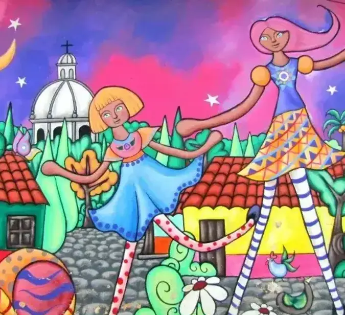 Colorful mural of two girls dancing in Ataco, El Salvador’s vibrant artistic highlands.